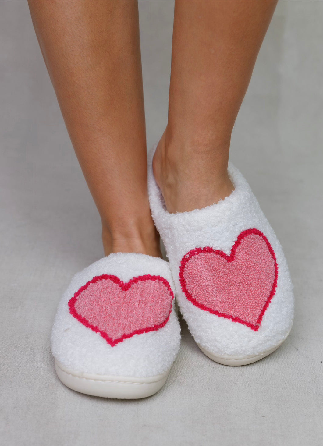 White slippers with pink heart